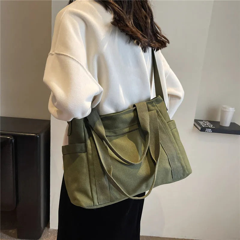 Large capacity polyester shoulder bag for women in four colours with mobile phone compartment
