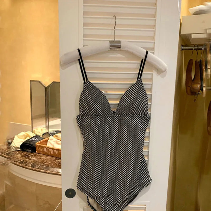 Blue and black one-piece swimsuit for hot springs with cover belly design for small chest.