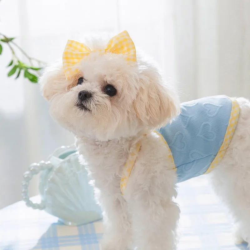 Small dog wearing heart texture bow suspenders vest in elastic material