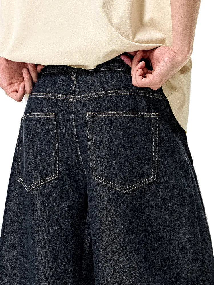 Men's wide leg denim trousers in original cow colour showing mid waist design and straight leg cut