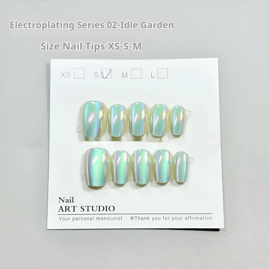 Set of electroplated Cat's Eye false nails showing Aurora armour and solid colour finishes on a hand.