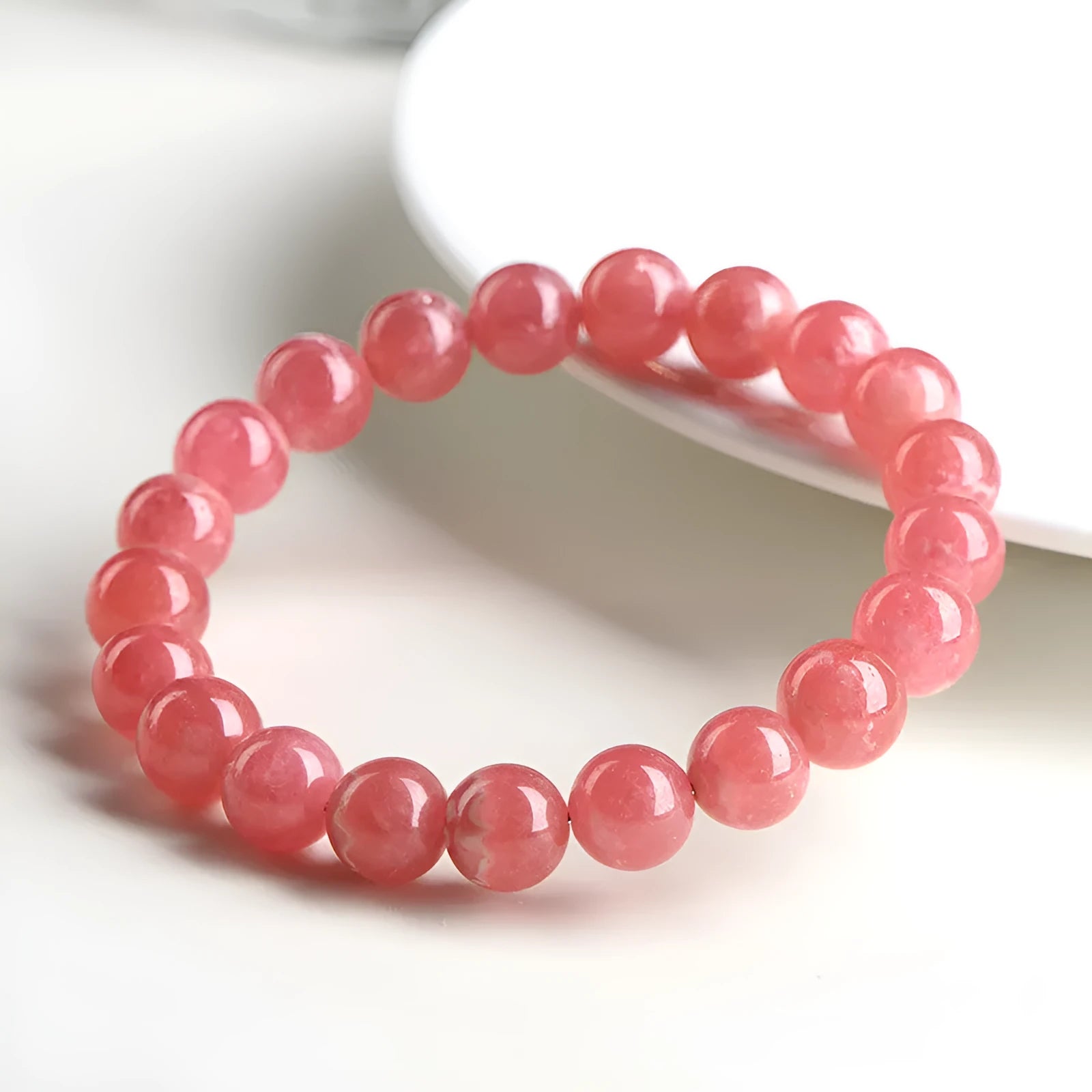 Women's geometric crystal bracelet with longevity lock design in red rhodochrosite stone