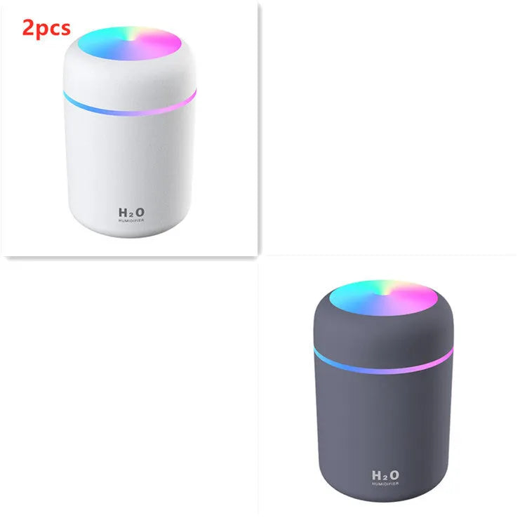 USB-powered mini humidifier with colourful LED lights in pink, white, or navy blue colour options