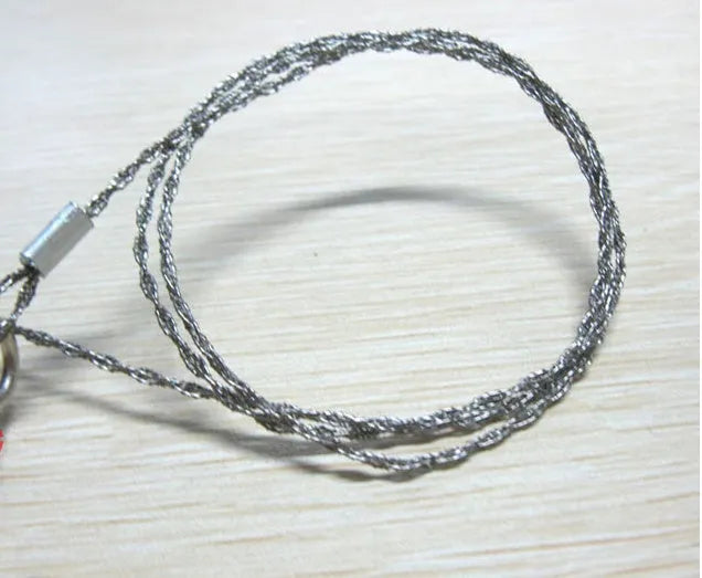 Survival wire saw with stainless steel blade, pull ring, and hoop handles for outdoor cutting