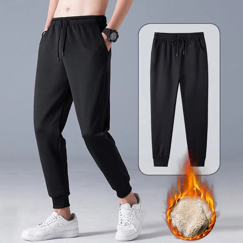 Black fleece lined straight leg trousers for men and women with drawstring waist, available in sizes M-5XL