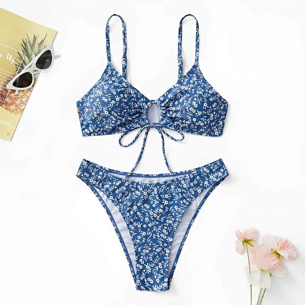 Blue women's swimsuit three-piece set with top and shorts, made from polyester fabric.