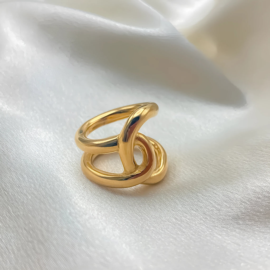 Adjustable open knot ring for women in stainless steel, showing geometric U-shape design in gold or steel colour.