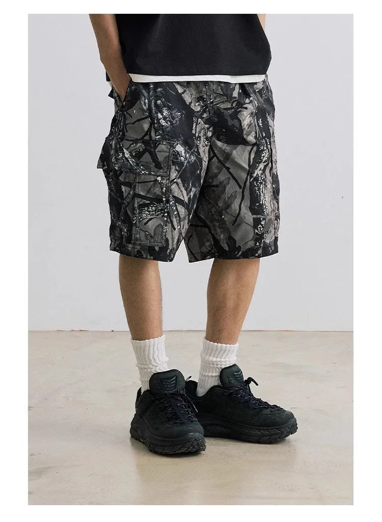 Loose fit straight-leg denim shorts on hanger, showing micro-elastic waistband and zip fly in army green colour.