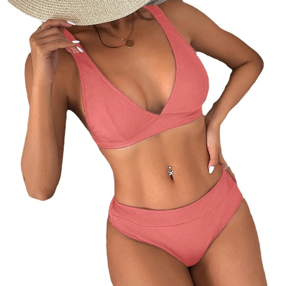 Women's black bikini with a rib texture and a front lace-up split design on a mannequin.