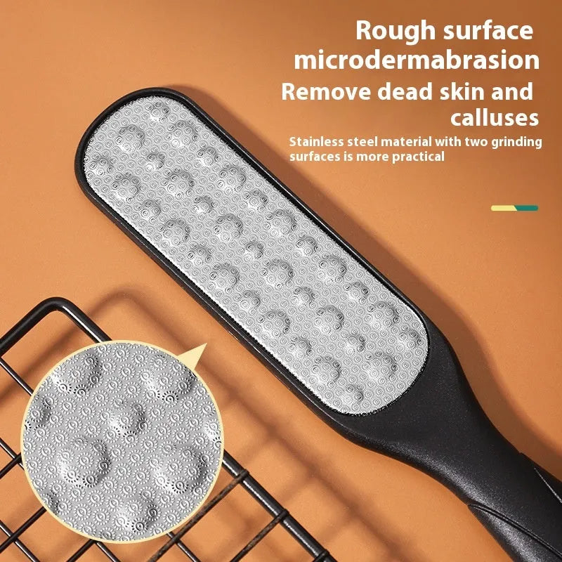 Stainless steel foot grinder tool with white and black double-sided abrasive files for callus removal.