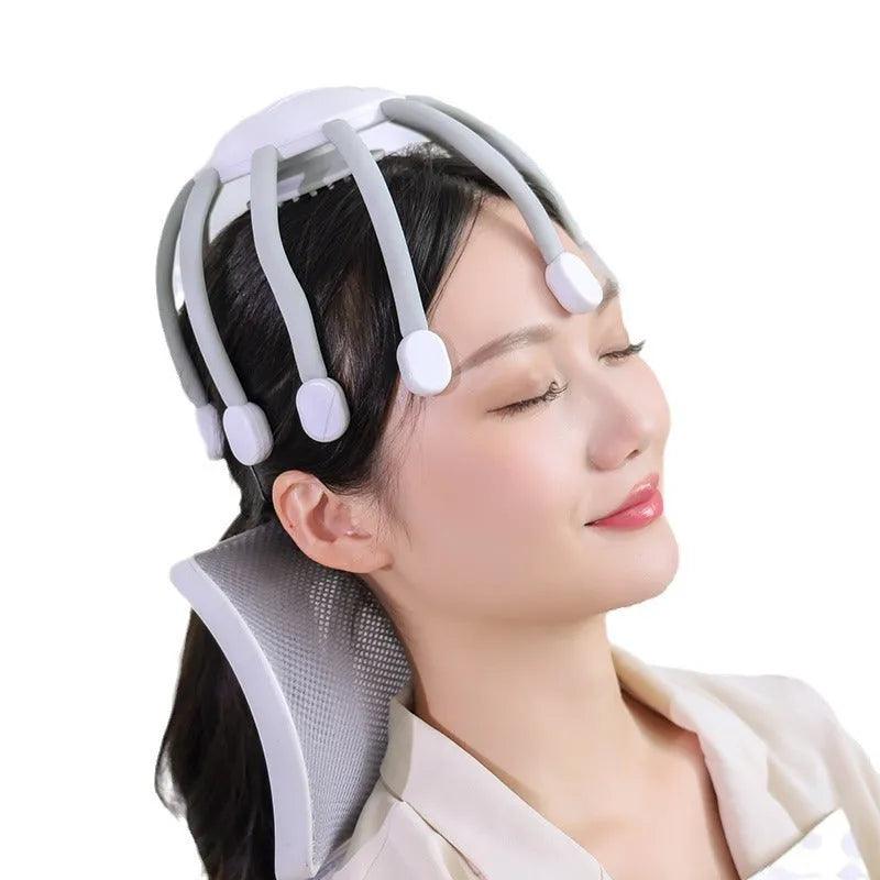A black head massager with multiple claws, connected via a USB cable, showing its four-mode control buttons.