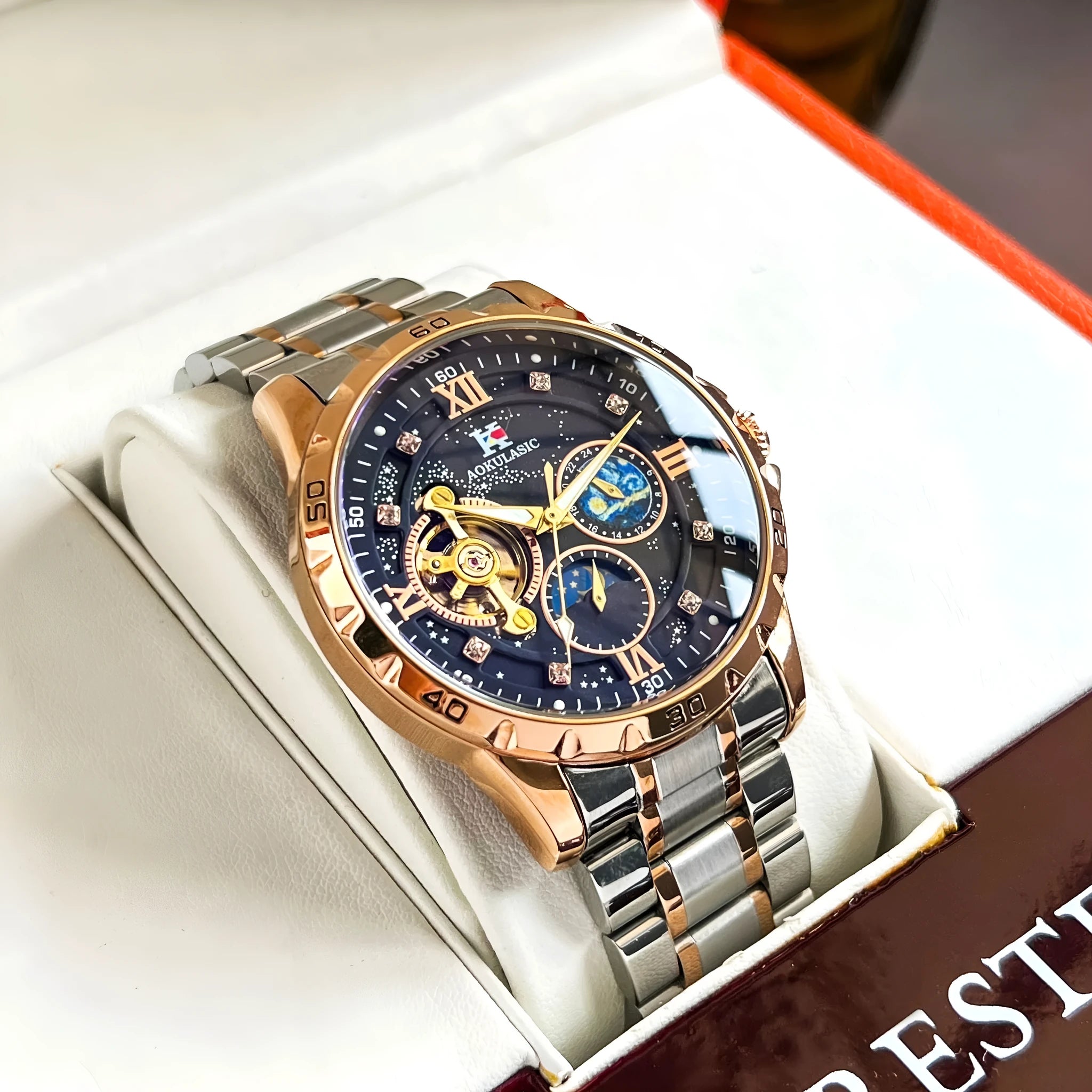 Rose gold automatic mechanical men's watch with black dial and large 44mm case.