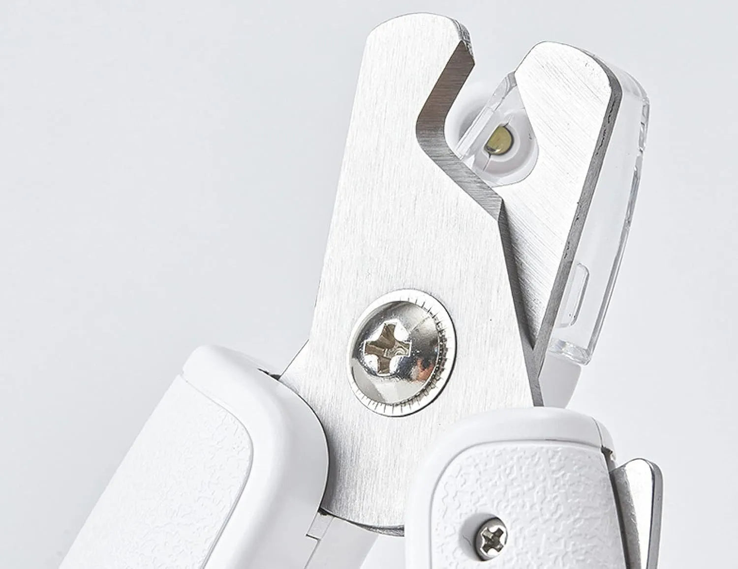 White LED pet nail clippers for dogs and cats with a transparent safety guard and leather-like handle.
