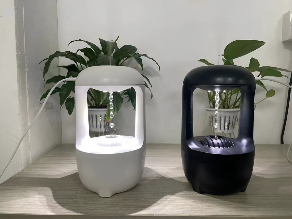 White anti-gravity water droplet humidifier with 500ml tank on a desk.