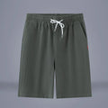 Solid colour cotton linen cropped pants with a drawstring waist on a hanger.