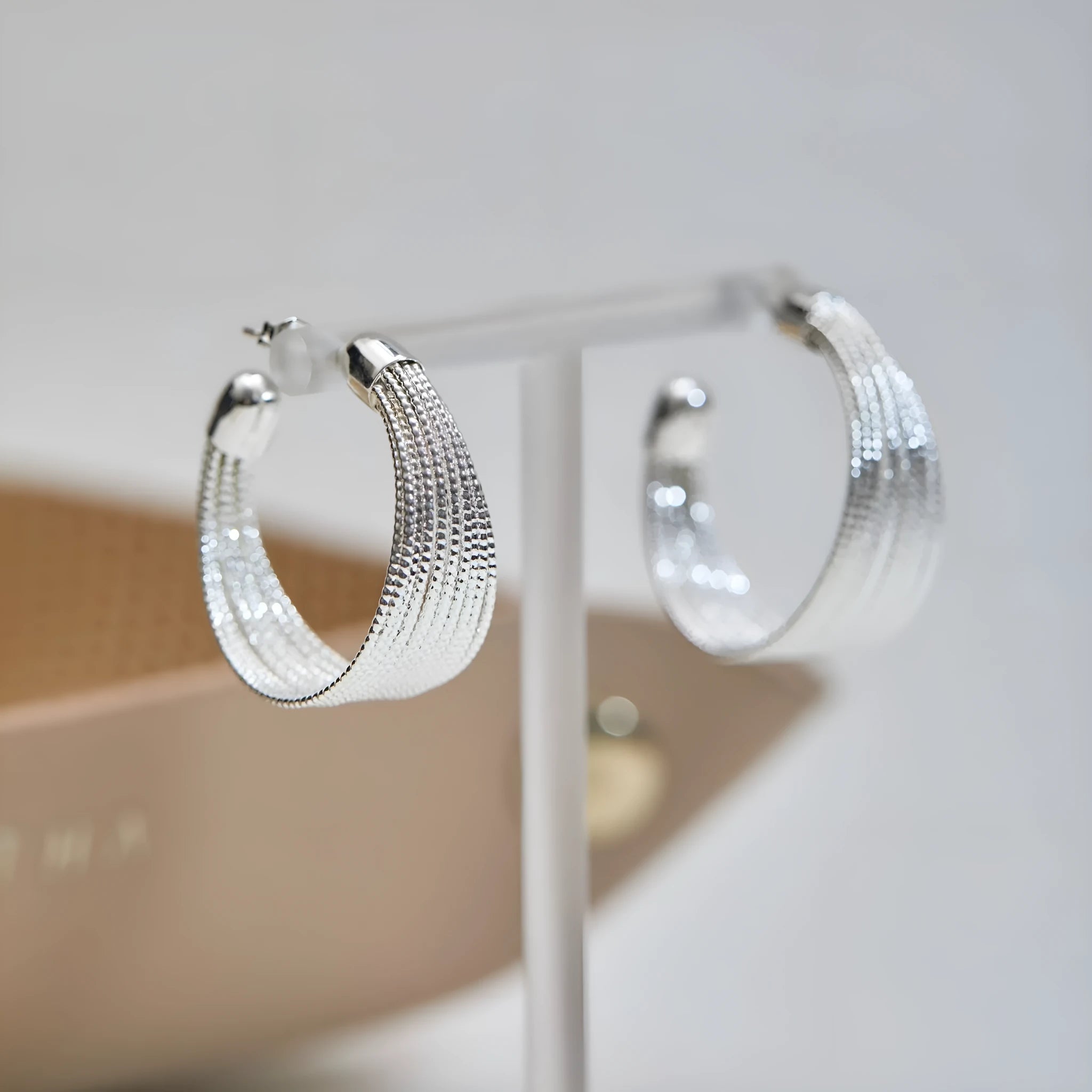 Multi-layer geometric earrings in gold and silver with stud and clip style options