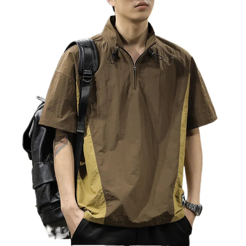 Brown men's loose fit short sleeve shirt with a half-zip stand collar, shown flat.