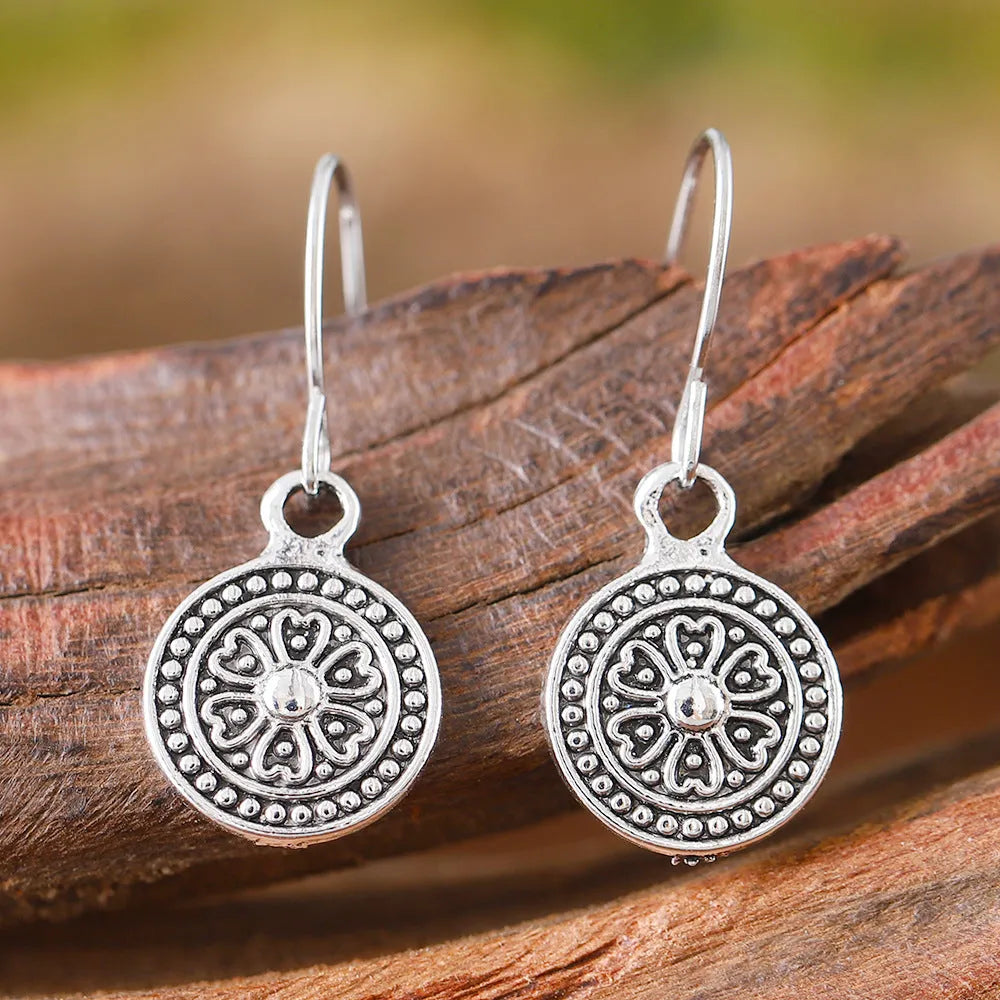 Bohemian retro geometric earrings with distressed ethnic detailing and round print design in zinc alloy