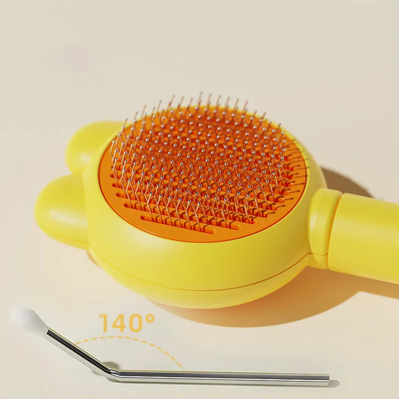 Self-cleaning pet grooming brush with release button in green, pink, purple or yellow