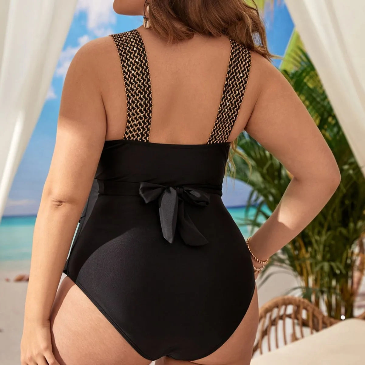 Women's black sleeveless one-piece swimsuit with a chest pad on a mannequin.