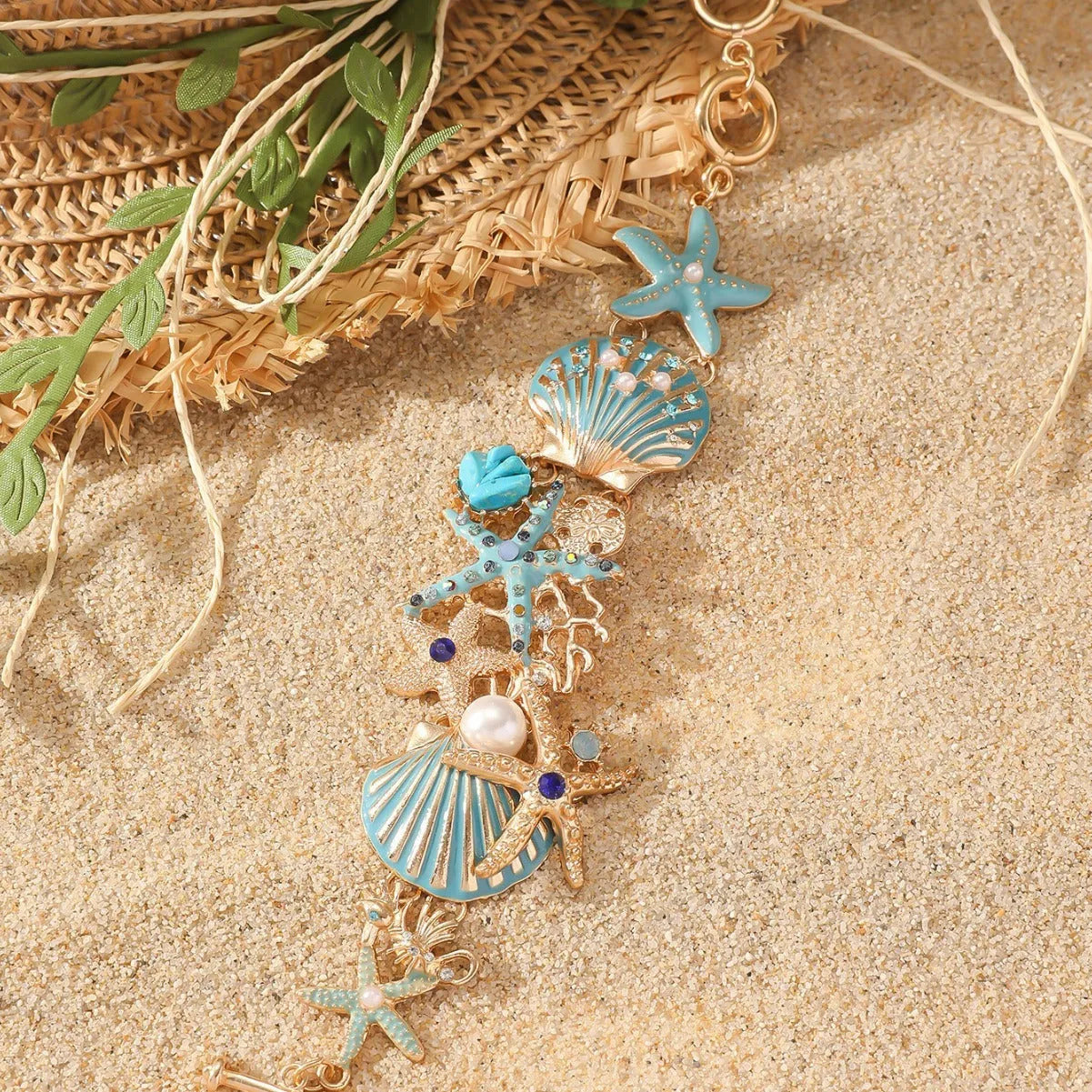 Women's alloy starfish bracelet in turquoise, coral red, or coral blue electroplated colour.
