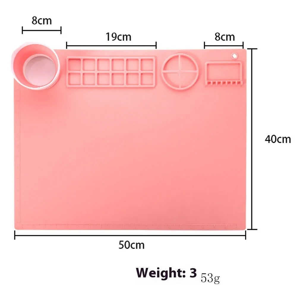Light blue silicone painting mat with two round mixing bowls on 40x50cm surface