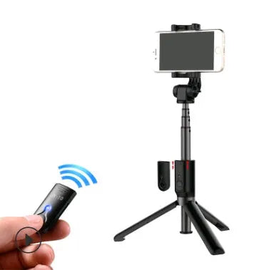 Black aluminium alloy Bluetooth selfie stick with tripod bracket extended, holding smartphone