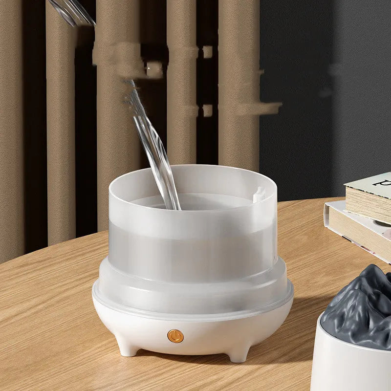 Volcano mountain-shaped humidifier in black colour with USB cable connection and mist output