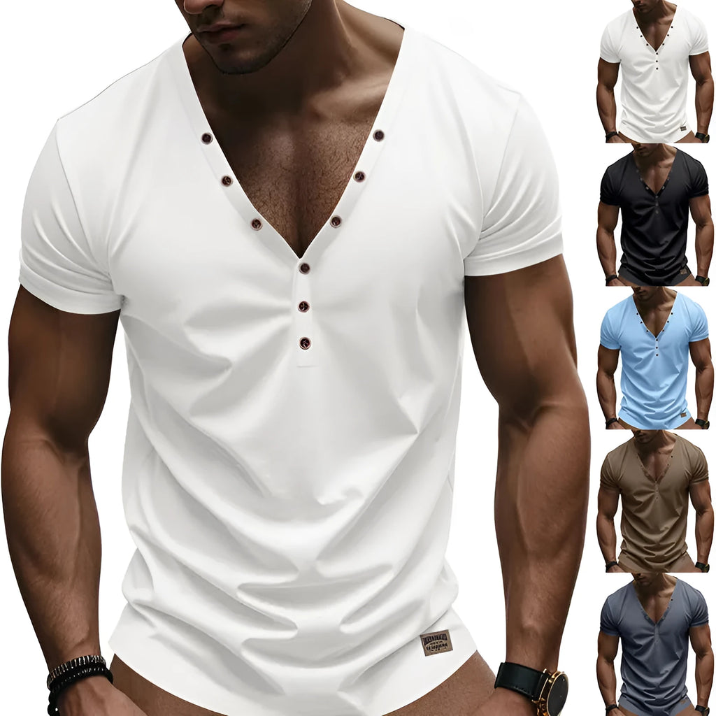 Man wearing a loose fit solid colour V-neck pullover top with a small button design detail.
