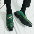 Men's black pointed-toe casual shoes with low-top design and sewn detailing on a rubber sole.