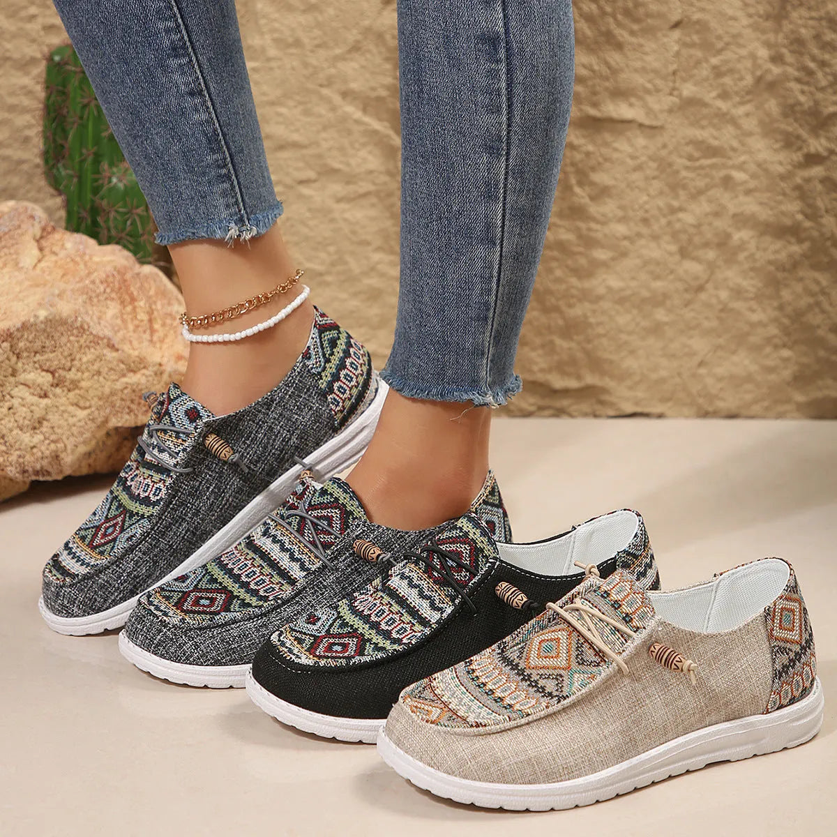 Women's flat slip-on shoes in black, dark grey, and khaki with round toe and rubber sole.