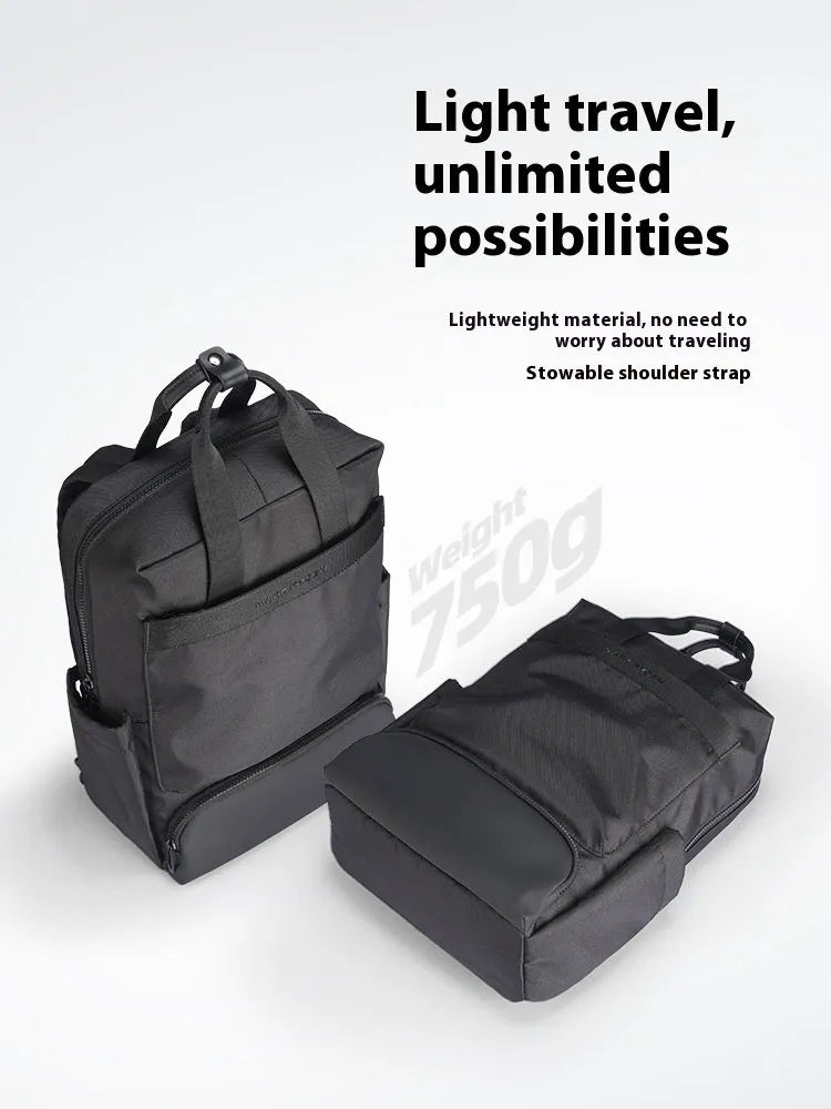 Black Oxford cloth computer backpack with a polyester lining, showing storage compartments.