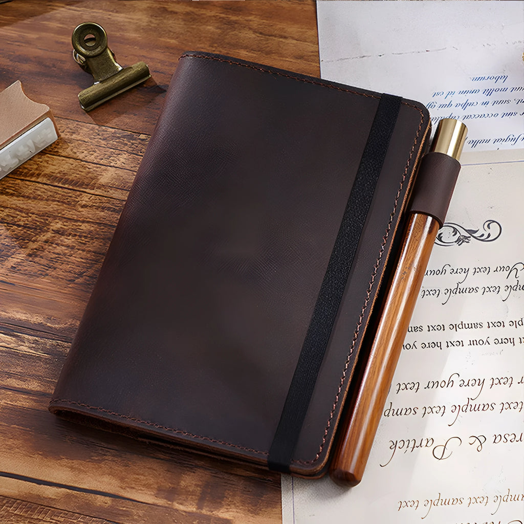 Handmade vintage Kraft notebook with cowhide cover in dark green, open to show wood-free paper pages