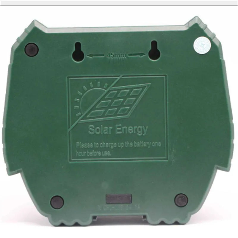 Green solar-powered ultrasonic animal repeller unit for outdoor pest control.