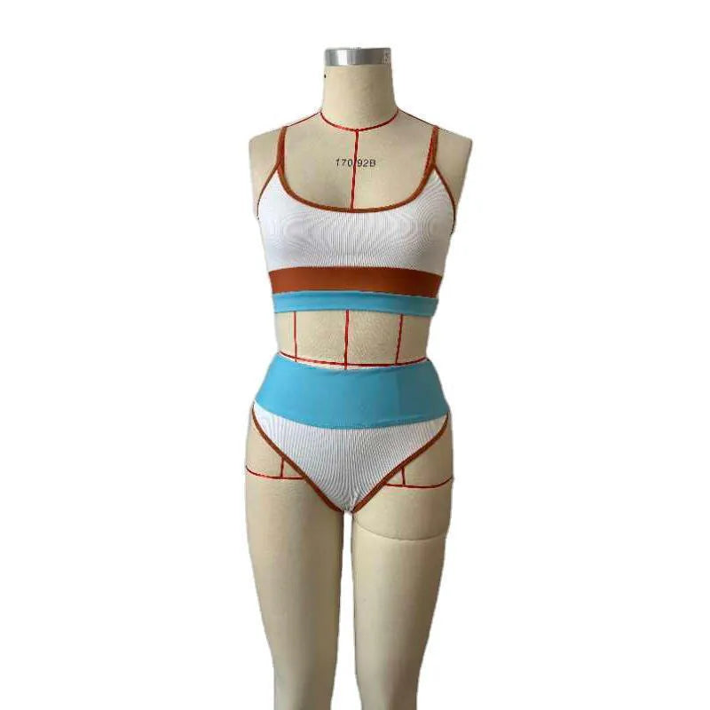 Women's solid colour quick-drying swimwear set with top and shorts.