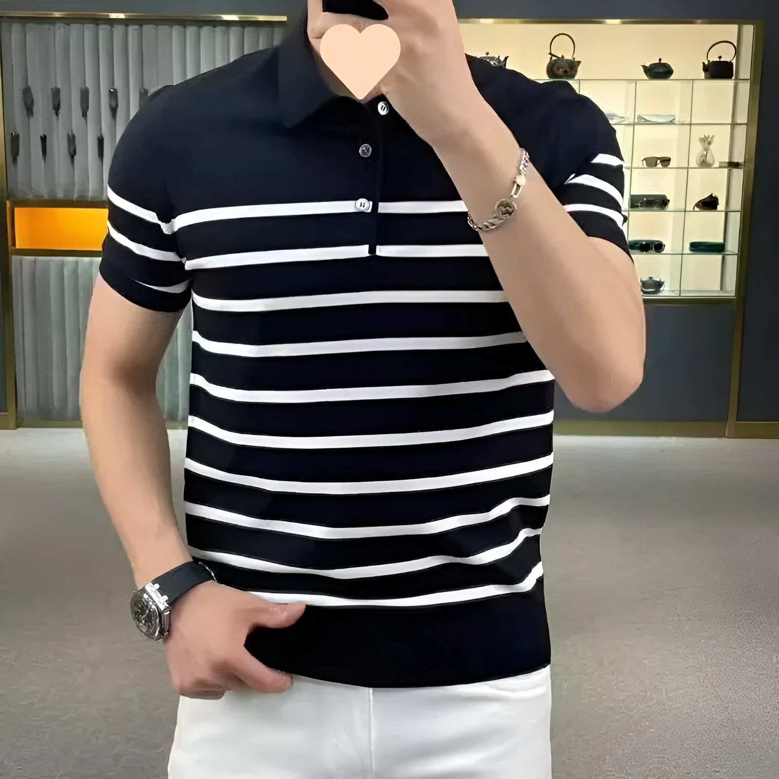 Black and white striped knitted T-shirt with a lapel collar, long sleeves, and a pullover style.