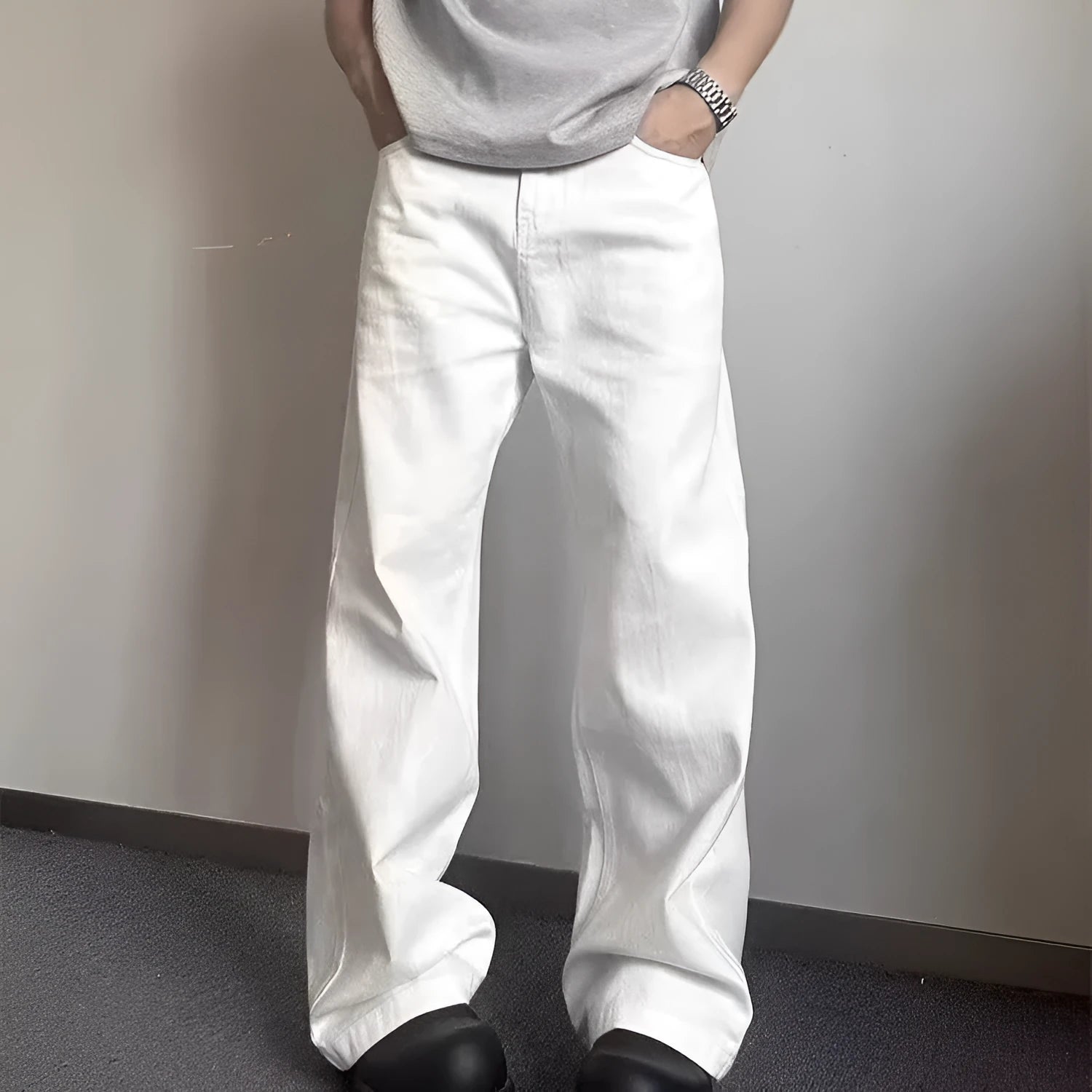 Men's straight-cut white wide-leg denim jeans with a mid waist and zipper fly