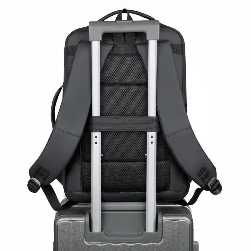 Large black waterproof backpack with curved shoulder straps showing business travel design