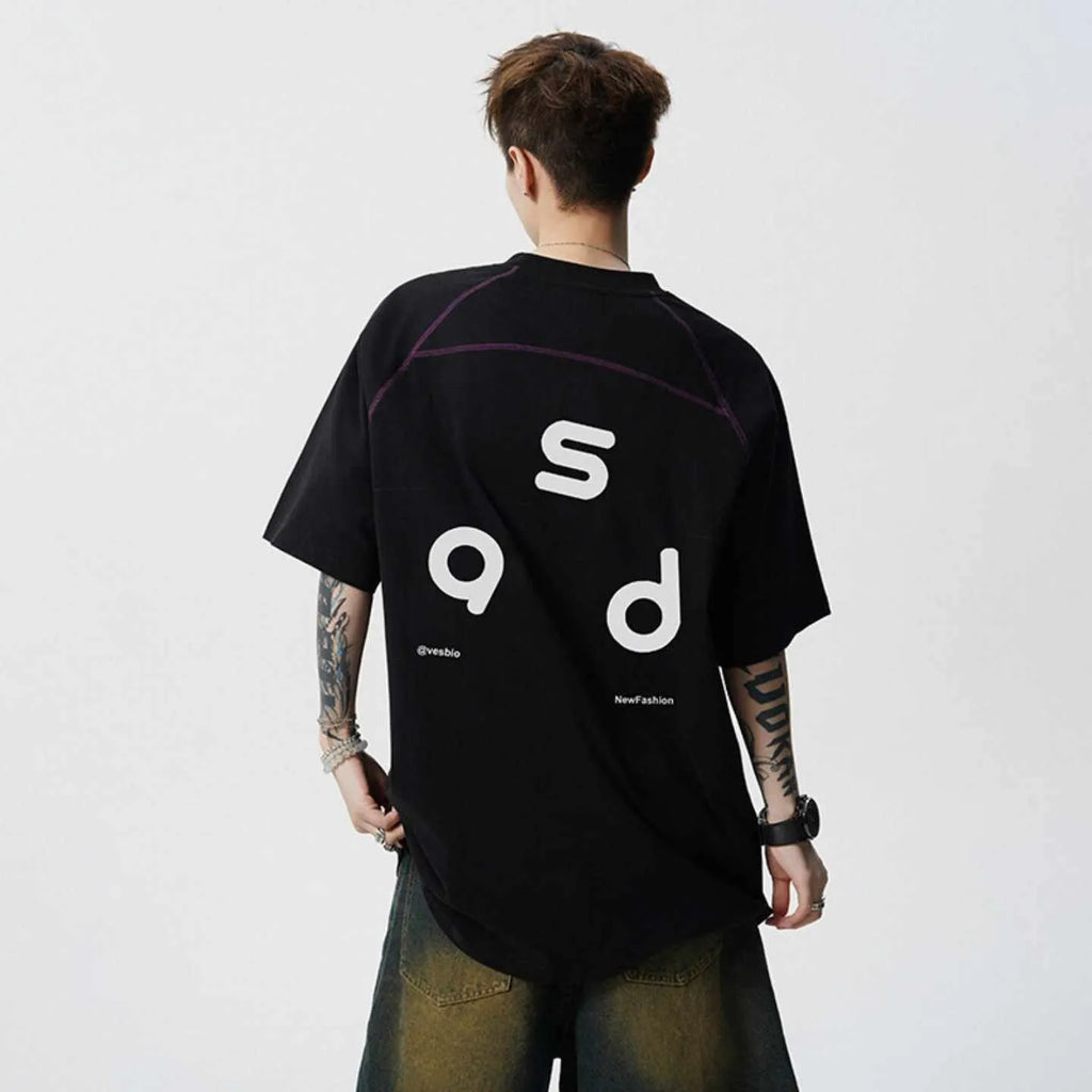 Black loose fit cotton T-shirt with short sleeves and a round neck collar featuring a letter print