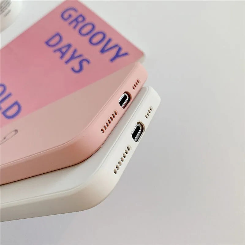 A selection of solid-colour TPU silicone back cover cases for various Apple iPhone models.
