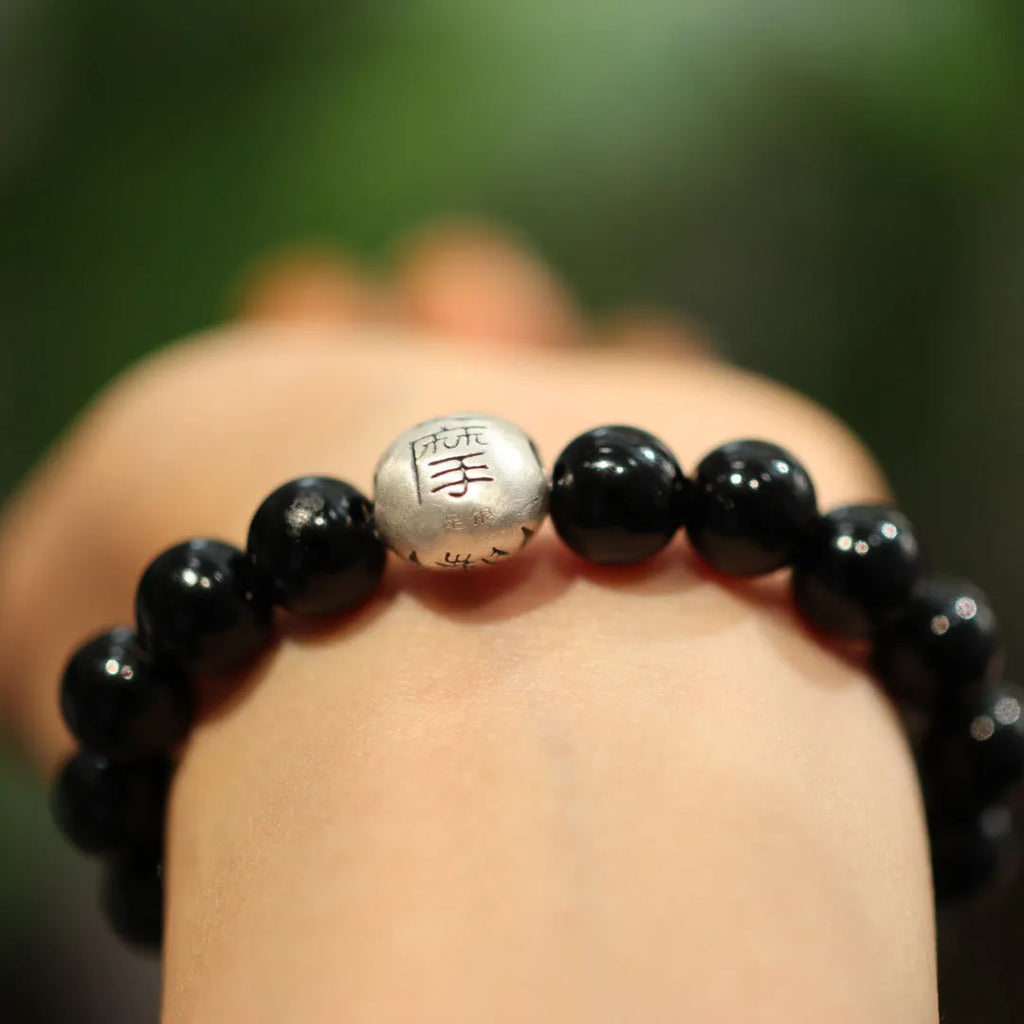 Women's black agate bracelet with 10mm beads and sterling silver in Chinese style design