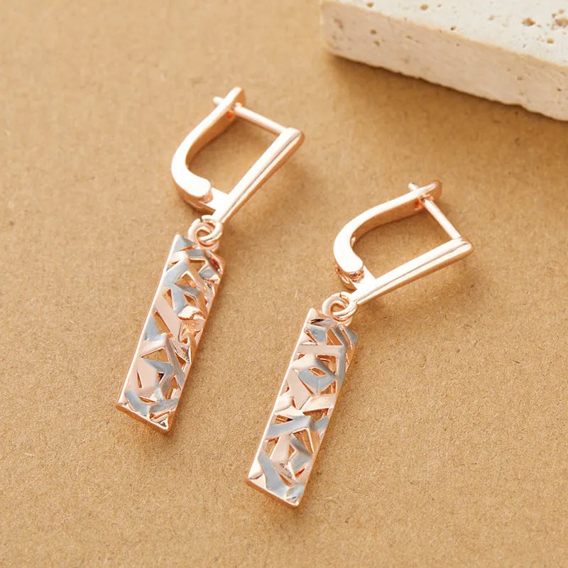 Rectangular hollow two-tone stud earrings with geometric pattern