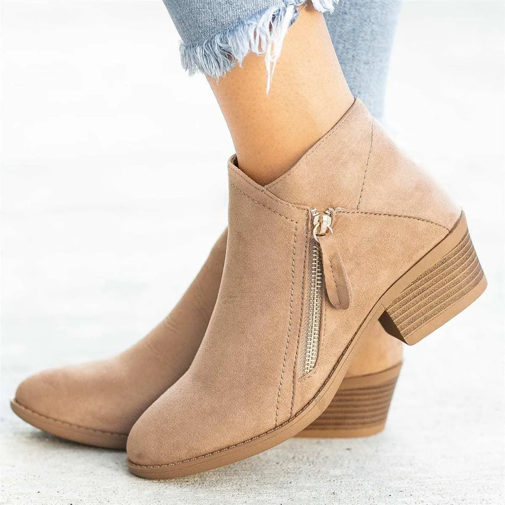 Women's suede ankle boots with chunky heel and side zip in beige, black, blue, or orange.