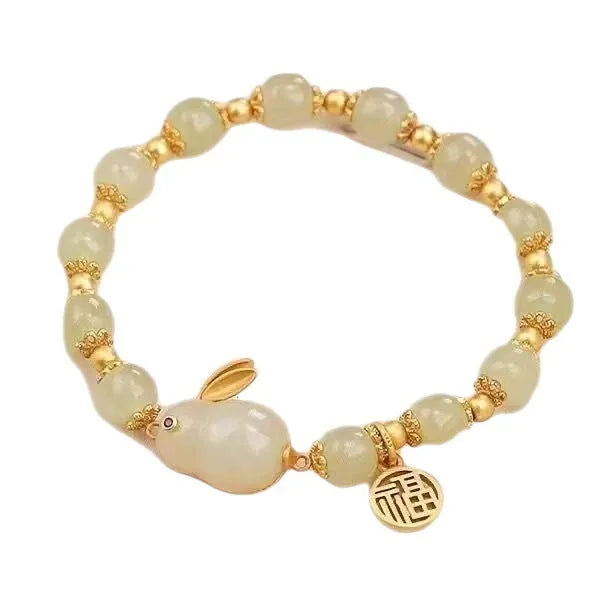 Women's green fu jade hare bracelet with black cord and lily motifs