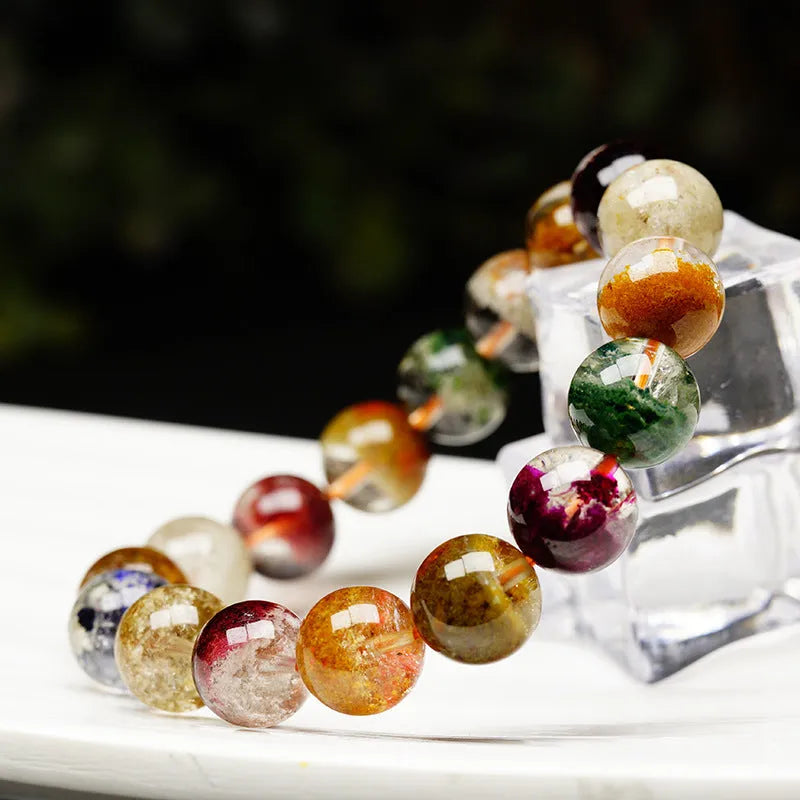 Ethnic style crystal bracelet with 10mm ball beads and colourful ghost cornucopia design.