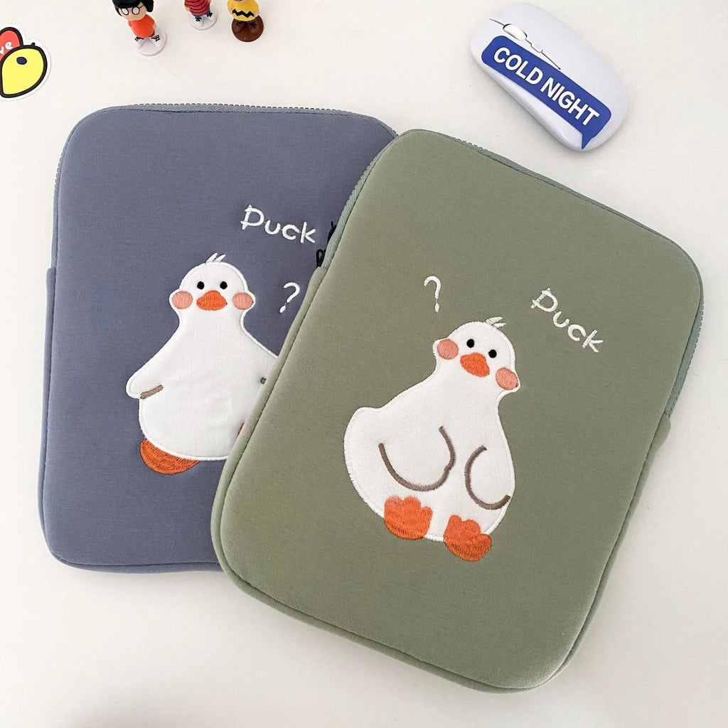 Blue cotton tablet case with cartoon duck embroidery and a zipper, shown next to a green version.