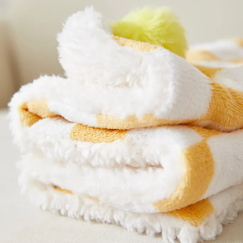 Green plaid pattern pet blanket with decorative fur balls for cats and dogs