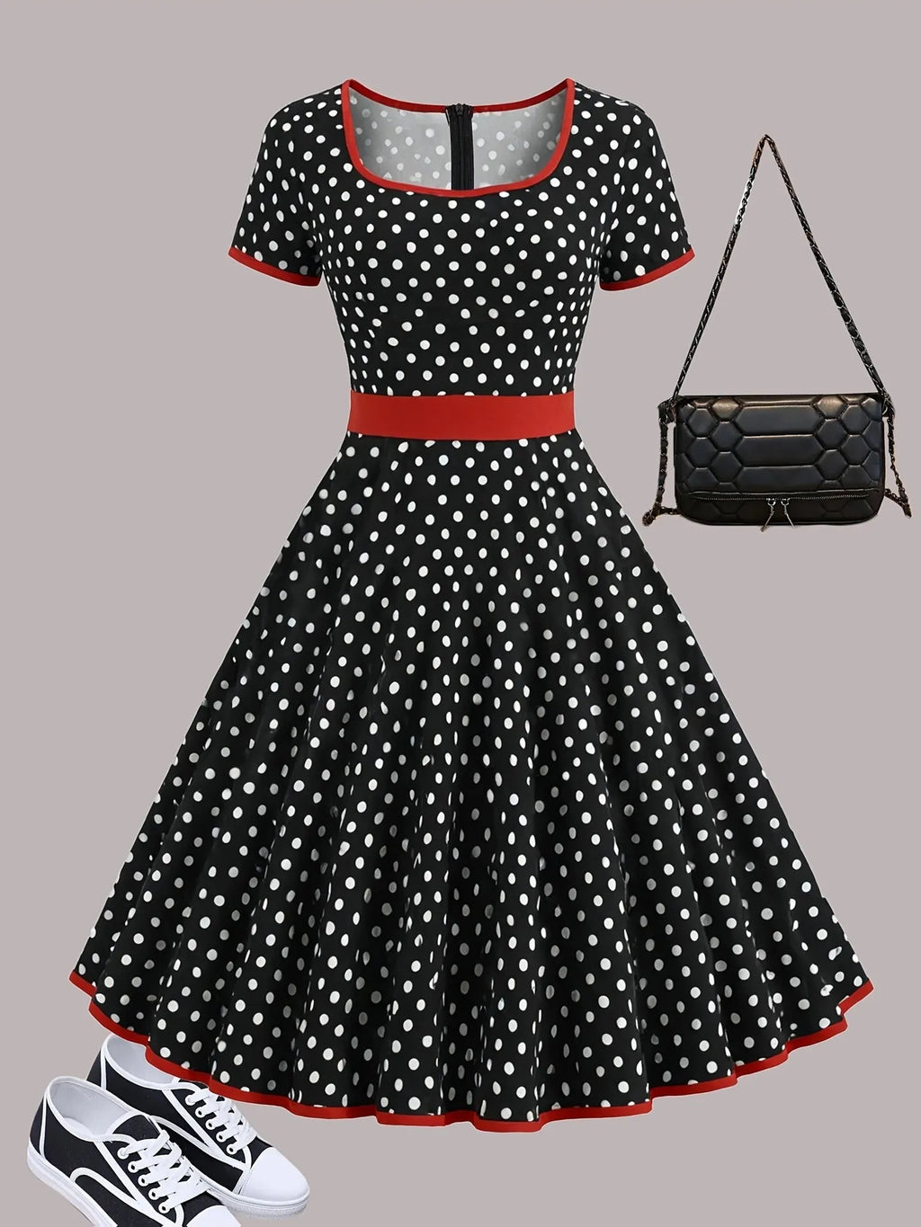 Square collar short sleeve polka dot dress with pleats and a zip on a mid-length skirt.