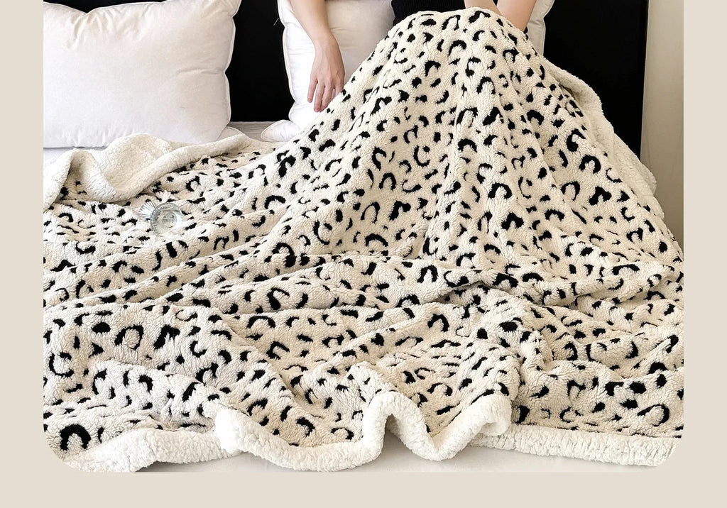 Double-layer leopard print jacquard taffeta blanket shown in camel zebra pattern