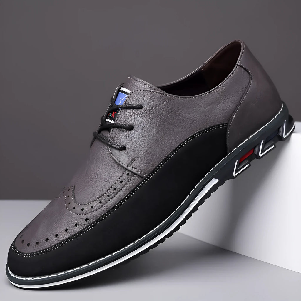 Men's black leather toe cap casual shoes with a rubber sole and sewing line detail on the fabric upper.